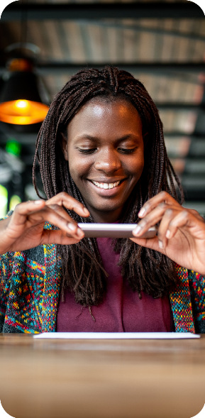 woman taking photo of check for mobile check deposit