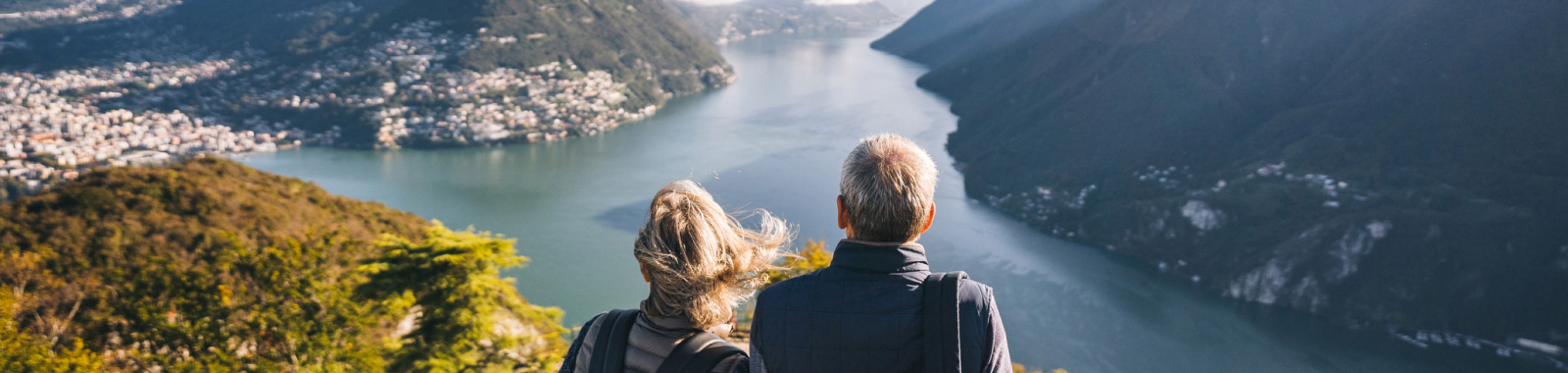 Couple outdoors on a hike looking at surrounding area