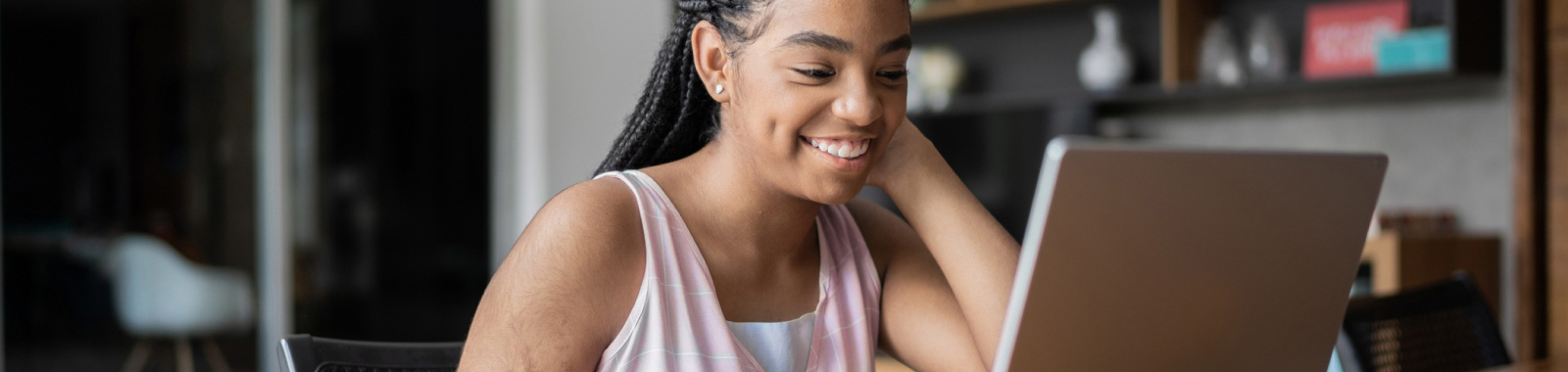 Woman smiling while on her laptop