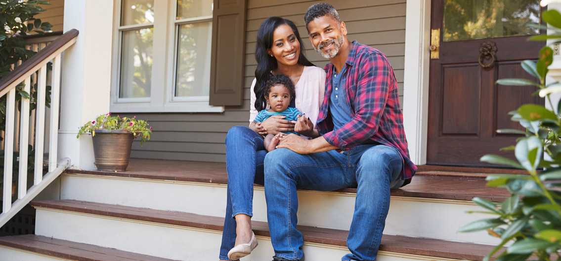 Family outside of new home