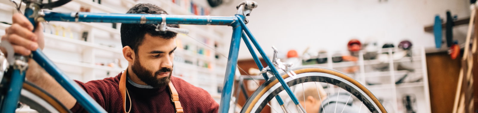 man holding bicycle