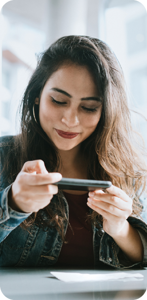 Women taking photo of check