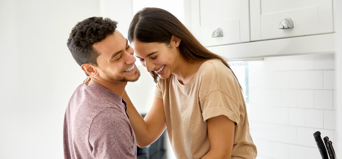 man and woman in kitchen